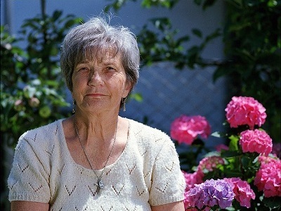 old-woman-white-blouse-flower.jpg
