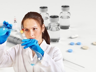 woman-doctor-white-coat-experiment-flask-400x300.jpg